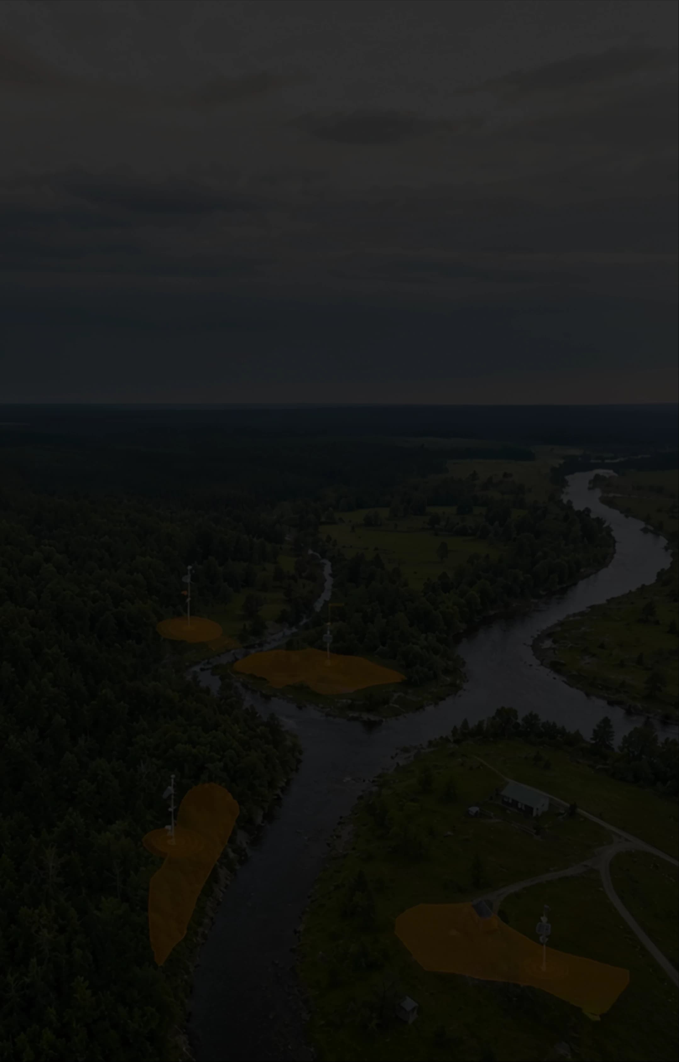 Environmental and wildlife monitoring hero showing remote field sensing across forest, river, and trail environments