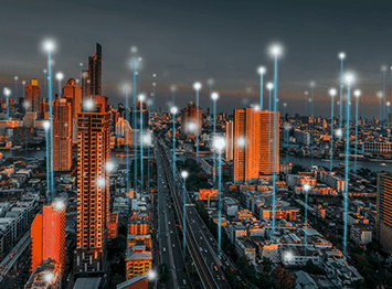 City skyline with smart lighting and IoT infrastructure