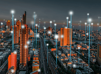 City skyline with smart lighting and IoT infrastructure connected via edge AI platforms