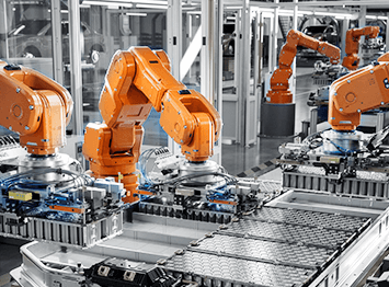 Robotic arms assembling products on smart factory line