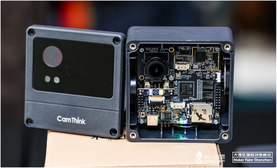 Developer using laptop to configure powerful Edge AI solution device for vision processing.